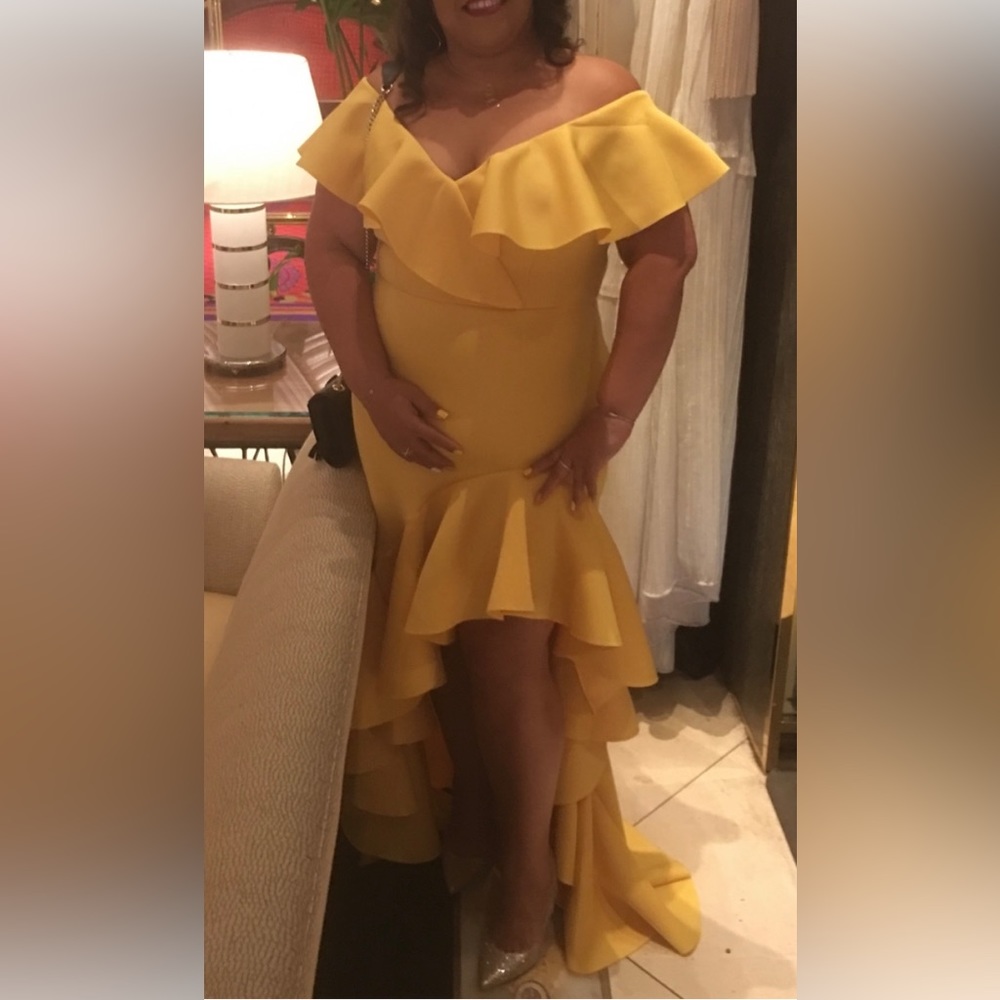 The perfect yellow frilly party dress that will make a statement.